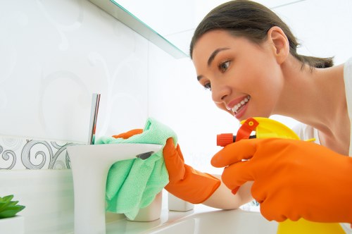 Cleaner wearing PPE during a professional cleaning task